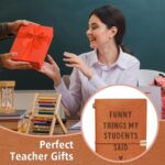 Brown faux leather journal with "Funny Things My Students Said" engraved on the cover, closed with an elastic band.
