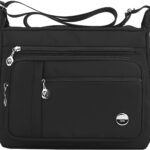 A large black nylon MINTEGRA satchel handbag with a top handle and an adjustable shoulder strap, showcasing its spacious and 