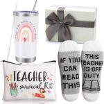 White 20 OZ insulated tumbler with teacher quote, funny socks, and a pen bag, all in a gift box.